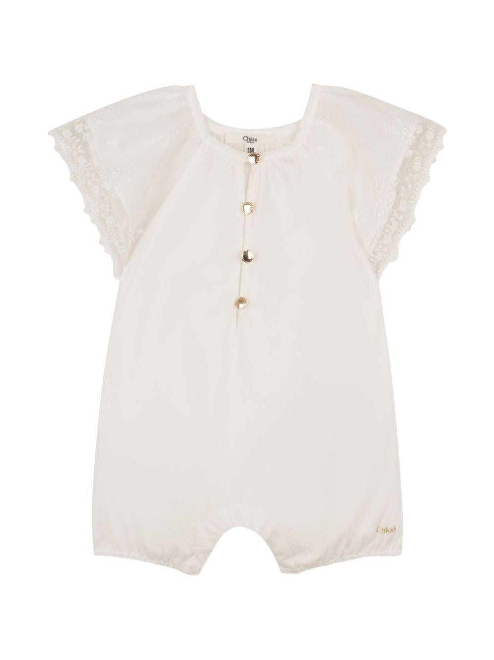 Tuta corta e fascia per capelli per neonata Chloé Kids bianche con bordo in pizzo - Rubino Kids