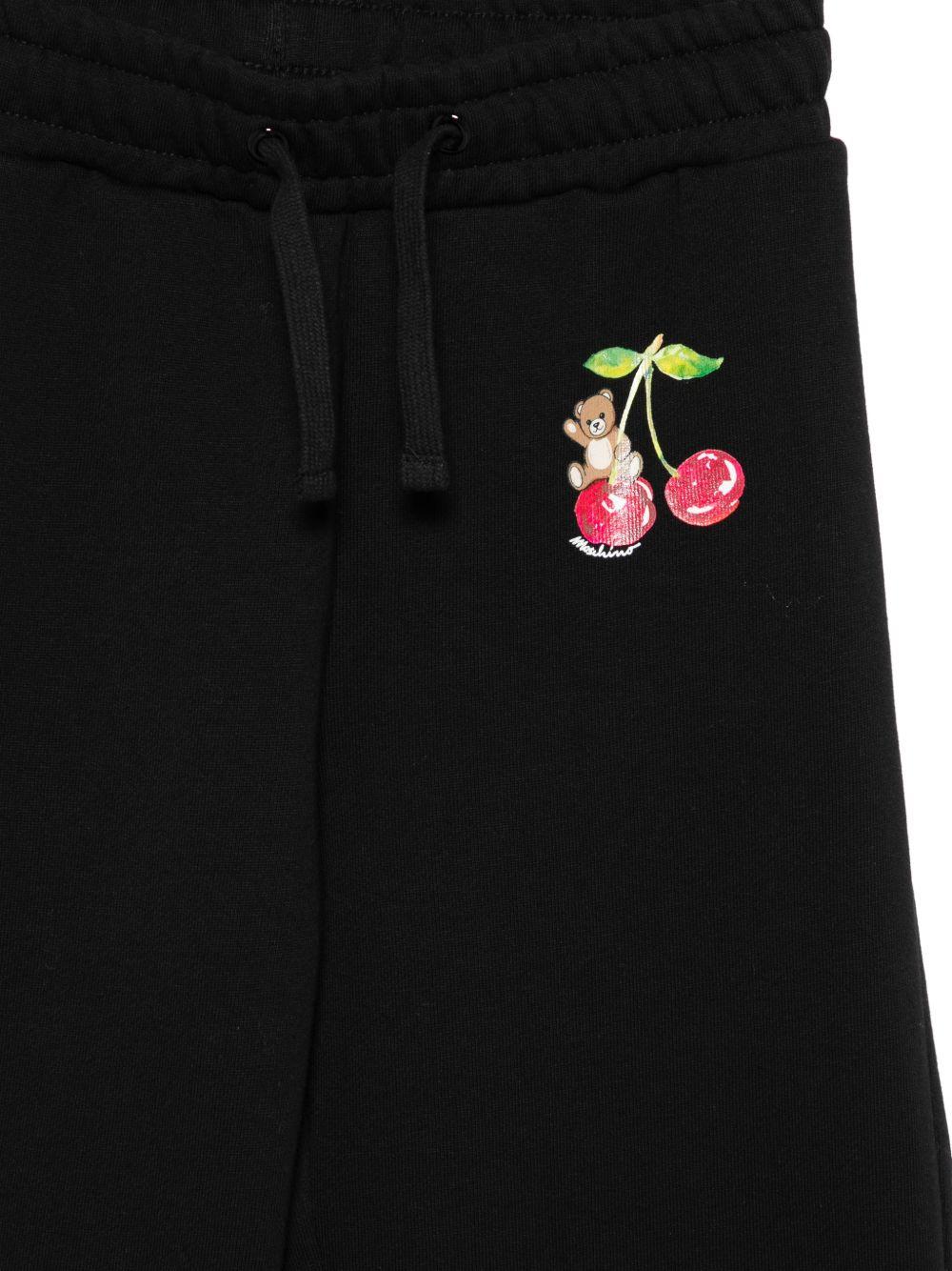 Tuta per bambina Moschino Kids nera con stampa grafica sul petto - Rubino Kids