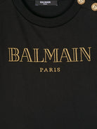 T-shirt con logo glitter per bambina Balmain Kids nero con bottoni oro BV8B91 Z0082 930OR BALMAIN KIDS 
