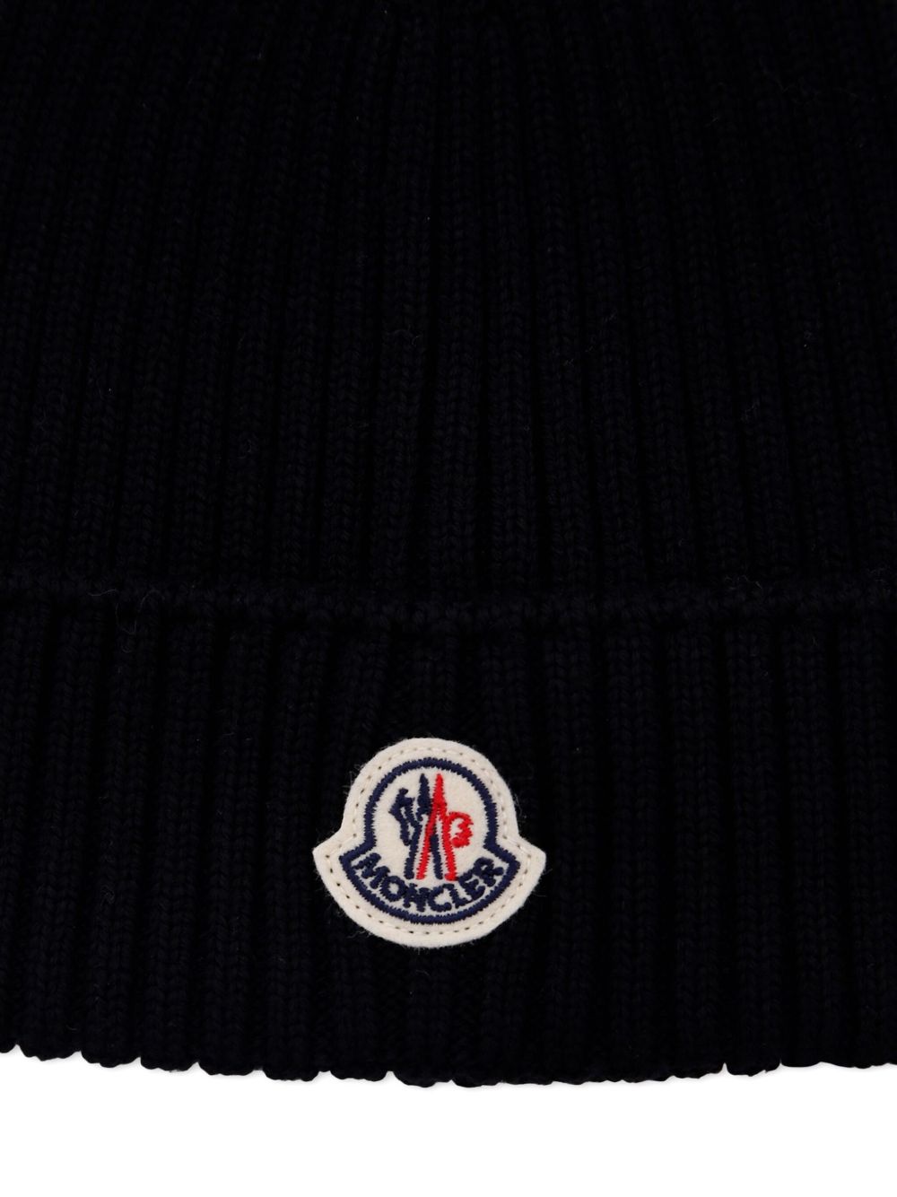 Berretto a coste per bambino Moncler Enfant nero con applicazione con logo K29543B00009M1131 999 MONCLER KIDS 