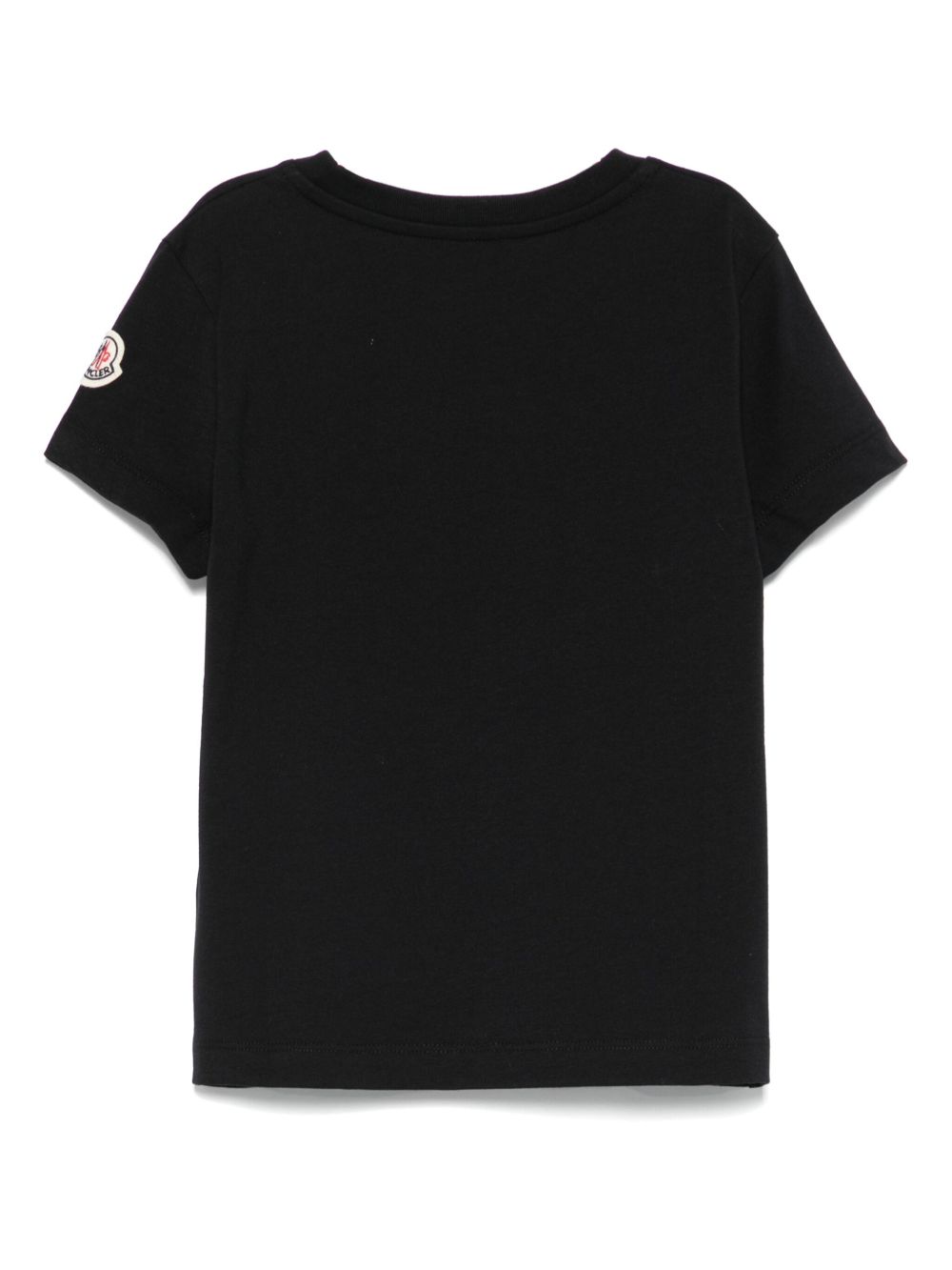 T-shirt per bambina Moncler Enfant nera con logo in rilievo e toppa sulla manica K29548C0001689AT9 999 MONCLER KIDS 