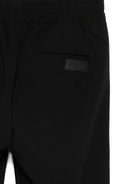Pantaloni per bambini MSGM Kids neri con elastico in vita e orli svasati F5MSJUPA054 MS040 MSGM KIDS 