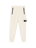 Pantaloni per bambino Stone Island Junior bianchi con applicazione con logo K2S163100006S0202 V0093 STONE ISLAND KIDS 