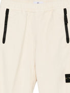 Pantaloni per bambino Stone Island Junior bianchi con applicazione con logo K2S163100006S0202 V0093 STONE ISLAND KIDS 