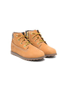 Stivali Pokey Pine per bambino Timberland Kids beige con logo laterale inciso TB1A125Q 2311 TIMBERLAND KIDS 