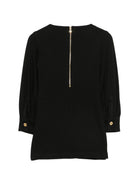 Abito per bambina Balmain Kids nero con placca con logo sul davanti BZ1B00 J0371 930OR BALMAIN KIDS 