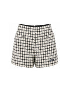 Shorts per bambina Balmain Kids bianco e neri con motivo a quadri BZ6B51 E0253 102AG BALMAIN KIDS 