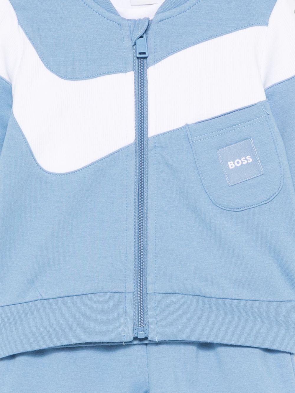 Tuta sportiva per neonato Boss Kids azzurra con chiusura con zip sul davanti J53306 81N BOSS KIDS 