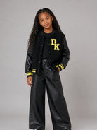 Giubbino per bambina DKNY Kids nero con rifinitura in shearling sintetico D62775 09B DKNY KIDS 
