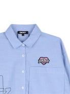 Camicia per bambina DKNY Kids azzurra con design a inserti D62781 V38 DKNY KIDS 