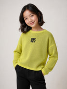 Maglione per bambina DKNY Kids verde con design reversibile D62898 T90 DKNY KIDS 