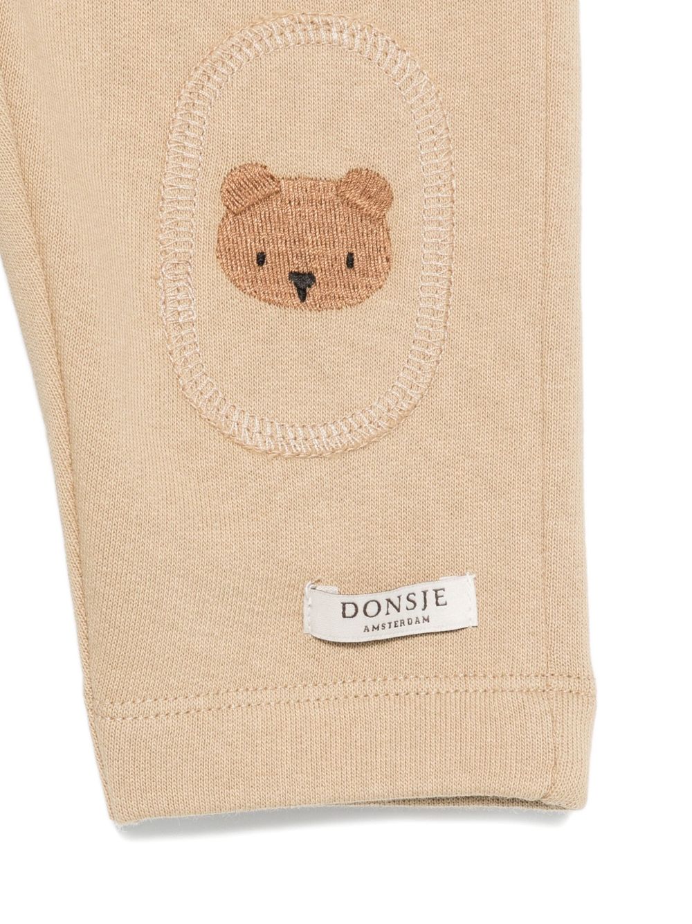 Pantaloni per neonato Donsje Kids beige con ricamo con orsetto 3040701 00077 DONSJE KIDS 