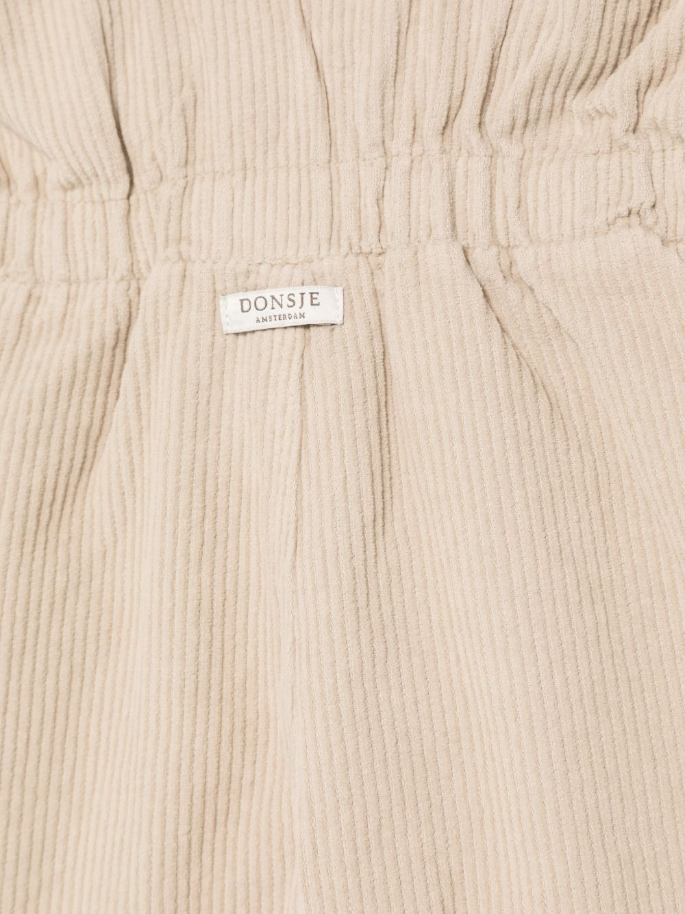 Salopette per neonata Donsje Kids beige con scollo a V 3050600 00017 DONSJE KIDS 