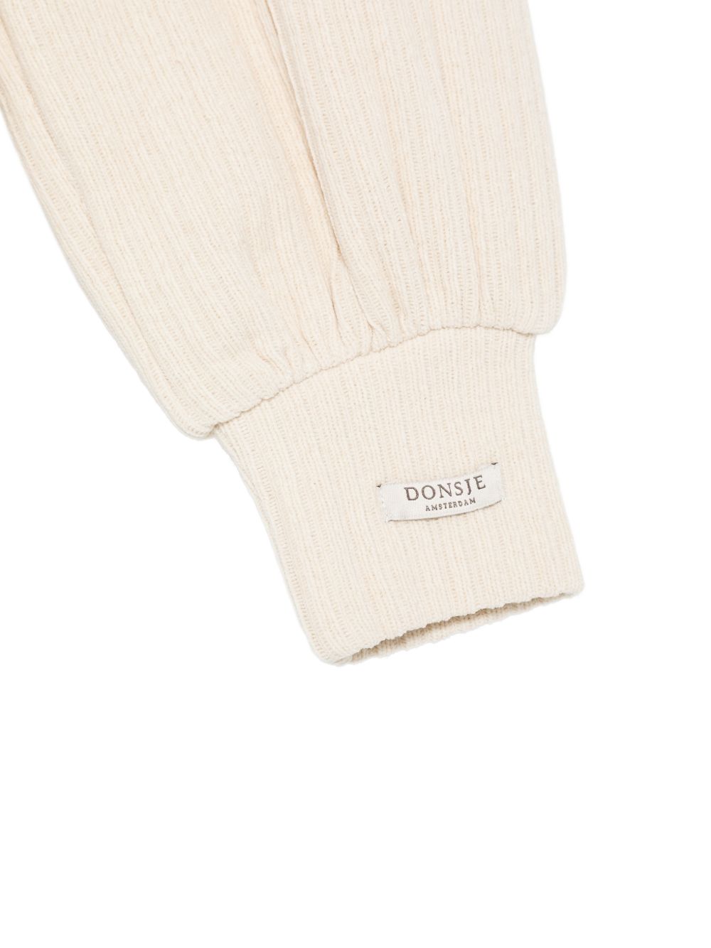 Pantaloni per neonata Donsje Kids bianchi con lavorazione in maglia a coste 3052000 00133 DONSJE KIDS 