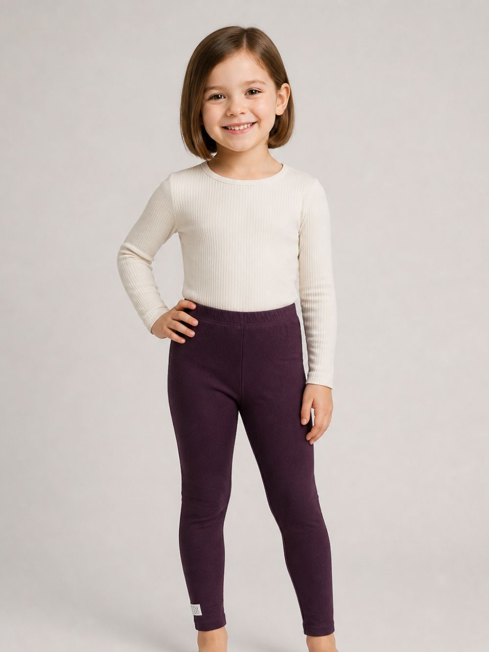 Leggins per bambina Douuod Kids viola con logo applicato sul lato DY6A20 J0331 558 DOUUOD KIDS 