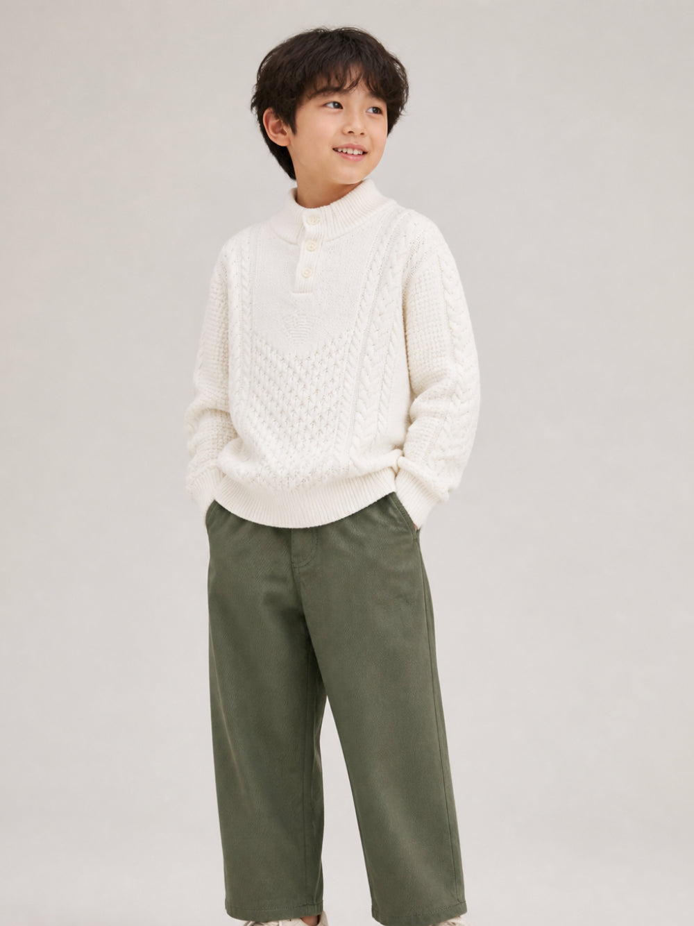Maglione per bambino Emporio Armani Kids bianco con design intrecciato EB001591 AF27319 U1009 EMPORIO ARMANI KIDS 