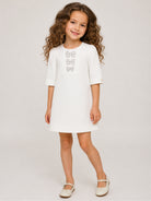 Abito per bambina Elie Saab Kids bianco con decorazioni fiocchi sul davanti EFAB135TS0802 WHT ElIE SAAB KIDS 