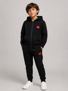 Pantaloni sportivi per bambino Hugo Kids neri con logo sul davanti G01182 09B Hugo KIDS 