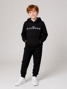 Set felpa e pantaloni sportivi per bambino John Richmond Kids nero con logo sul davanti RBA26007CF BLACK JOHN RICHMOND KIDS 