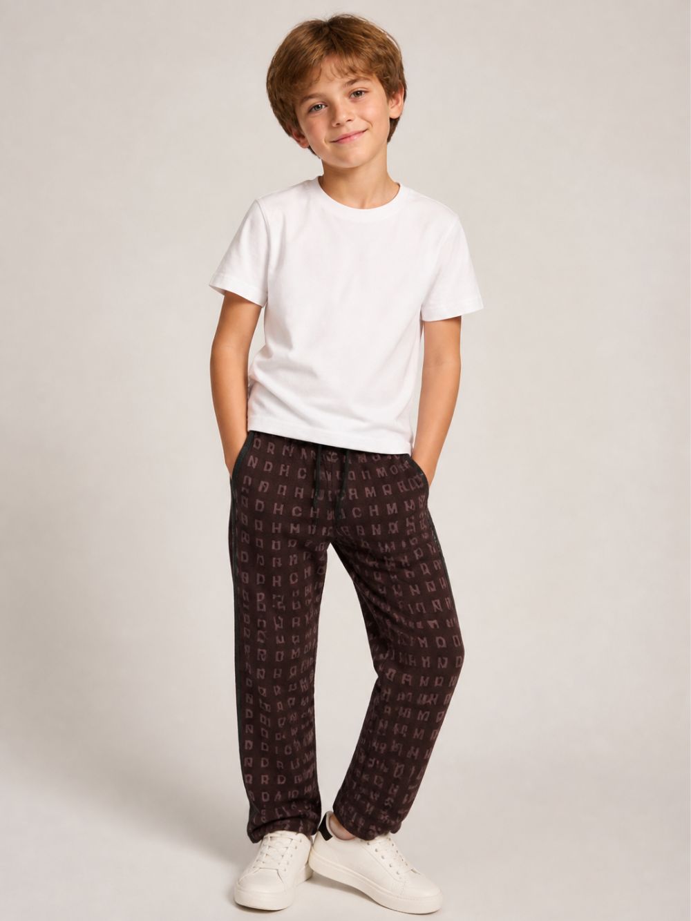 Pantaloni sportivi per bambino John Richmond Kids  con stampa con logo all-over RBA26052PA BROWN JOHN RICHMOND KIDS 