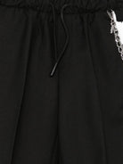 Pantaloni per bambino John Riichmond Junior neri con dettaglio catena RBA26126PA BLACK JOHN RICHMOND KIDS 