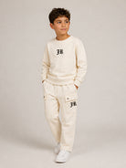 Set felpa e pantaloni per bambino John Richmond Kids beige con logo sul davanti RBA26167CF CREAM JOHN RICHMOND KIDS 