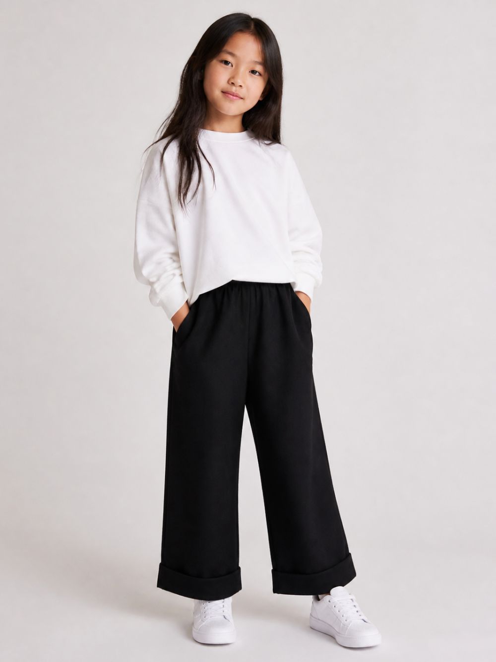 Pantaloni per bambina John Richmond Kids neri con orli con risvolto RGA26055PA BLACK JOHN RICHMOND KIDS 