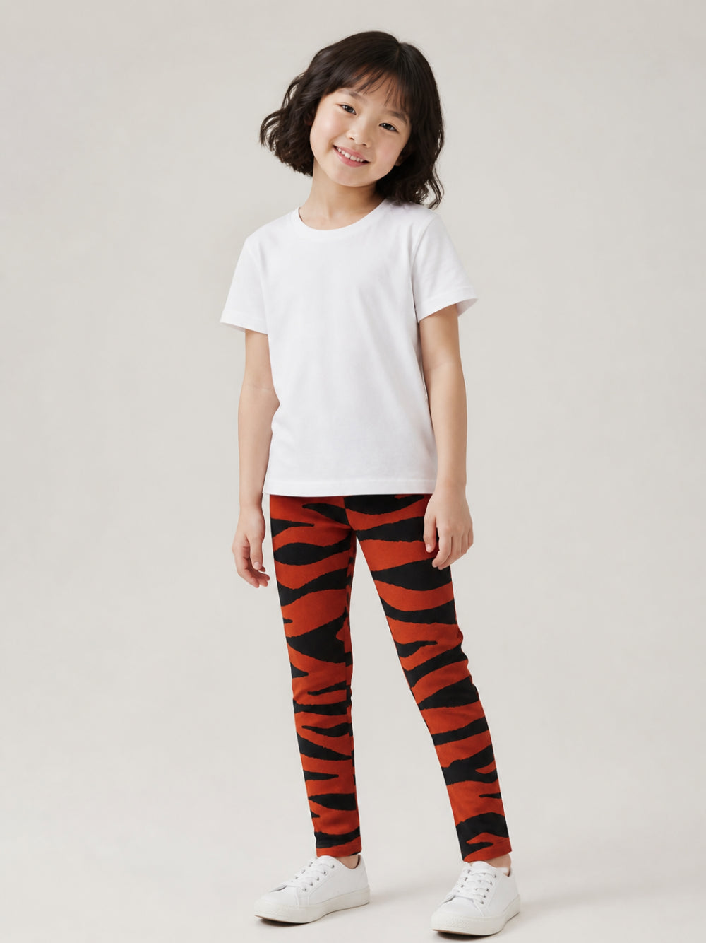 Leggings per bambina Kenzo Kids arancione e nero con stampa animalier K61964 Q50 KENZO KIDS 