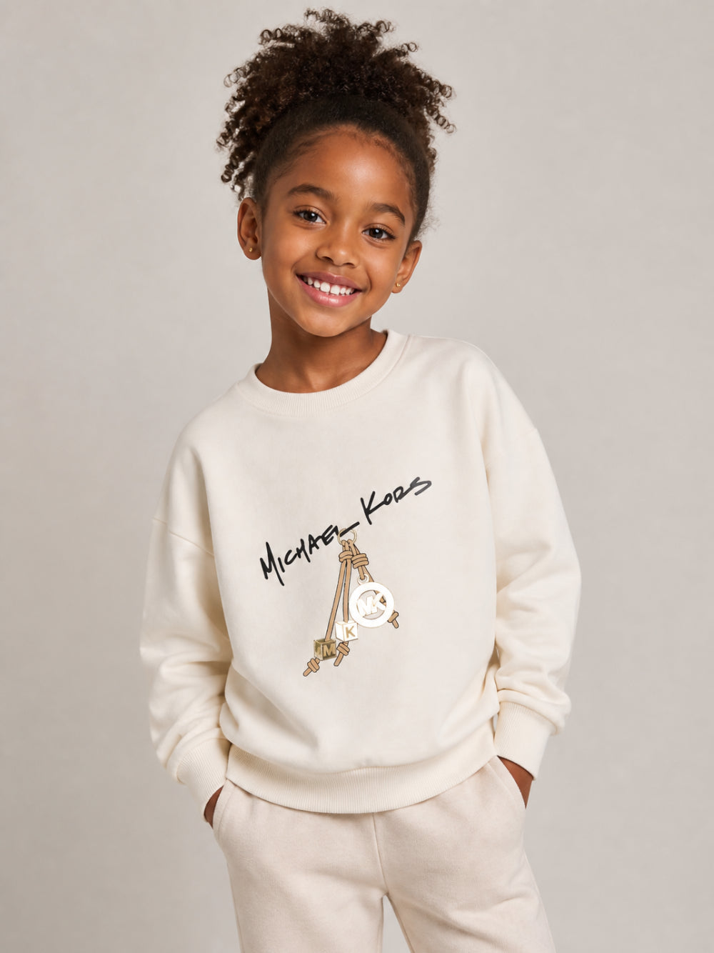 Felpa per bambina Michael Kors Kids beige con stampa grafica R30708 190 MICHAEL KORS KIDS 