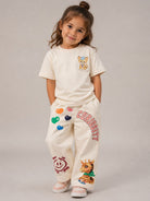 Jeans per bambina Molo Kids beige a gamba ampia con stampa 2W26I108 2444 MOLO KIDS 