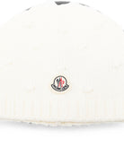 Berretto per neonata Moncler Kids bianco con dettagli pon pon L29513B00010M4281 035 MONCLER KIDS 