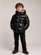 Giubbino Yule per bambino Moncler Kids nero con design imbottito L29541A00066597YX 778 MONCLER KIDS 