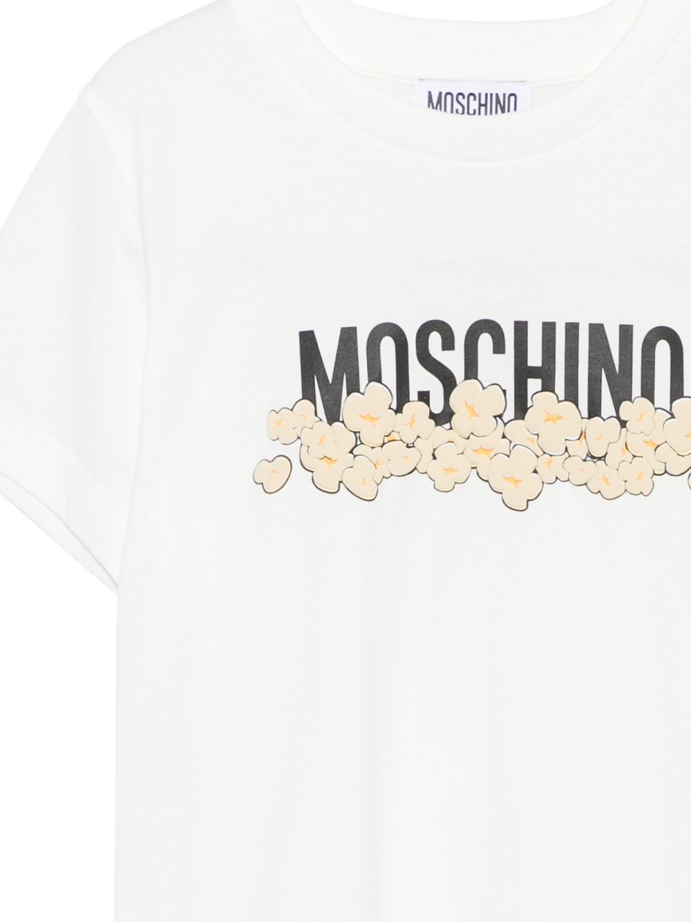 T-shirt per bambini Moschino Kids bianca con stampa grafica con logo H6M058LAA20 10063 MOSCHINO KIDS 
