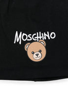 Berretto per bambino Moschino Kids nero con stampa grafica HNX02MLCA94 60100 MOSCHINO KIDS 