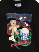 T-shirt per bambini Moschino Kids nera con stampa grafica sul davanti HPM05WLAA10 60100 MOSCHINO KIDS 