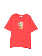 T-shirt per bambini Moschino Kids rossa con stampa Teddy con albero di Natale HQM05WLAA10 50109 MOSCHINO KIDS 