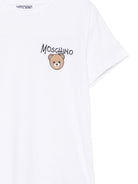 T-shirt per bambini Moschino Kids bianca con stampa logo sul davanti HUM05VLAA34 10101 MOSCHINO KIDS 