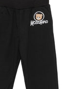 Pantatuta per bambino Moschino Kids nero con patch orsetto applicata HUP09DLCA83 60100 MOSCHINO KIDS 