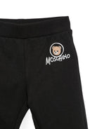 Pantaloni per neonati Moschino Kids neri con stampa Teddy Bear MUP062LCA83 60100 MOSCHINO KIDS 