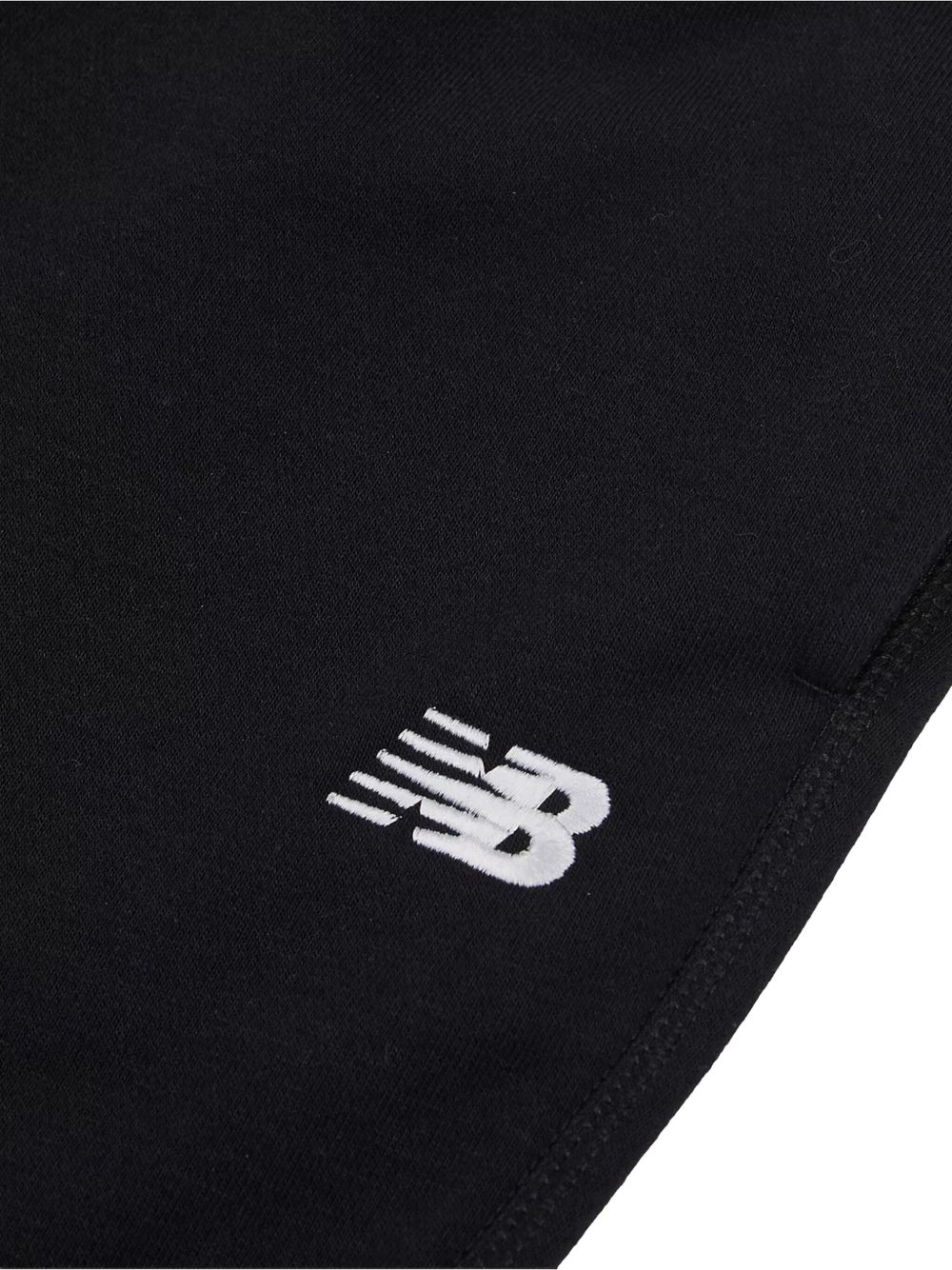 Pantaloni sportivi per bambini New Balance Kids neri con stampa logo sul davanti LAKB0060 BK NEW BALANCE KIDS 