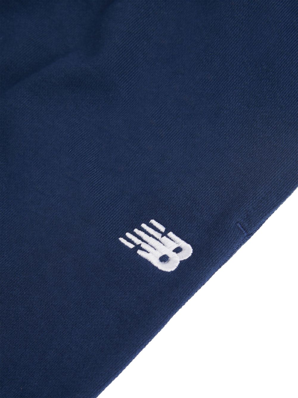 Pantaloni sportivi New Balance Kids blu con logo stampato sul davanti LAKB0060 NNY NEW BALANCE KIDS 
