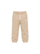 Pantaloni sportivi New Balance Kids beige con logo stampato sul davanti LAKB0060 SOT NEW BALANCE KIDS 