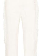 Pantaloni per bambina Stella McCartney Kids bianchi con dettaglio frange sui lati TZ6A50 Z0156 101 STELLA McCARTNEY KIDS 