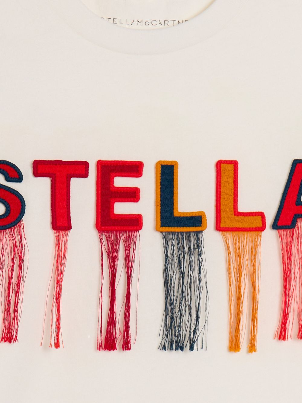 T-shirt per bambina Stella McCartney Kids bianca con frange applicate TZ8C51 Z3772 101 STELLA McCARTNEY KIDS 