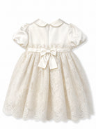 Abito per neonata Dolce & Gabbana Kids bianco con fiocco in rilievo sul davanti L24DT4 G7P4A S9000 DOLCE & GABBANA KIDS 