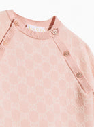 Tutina per neonata Gucci Kids rosa con logo GG jacquard 866239XKEZP 5012 GUCCI KIDS 