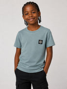 T-shirt per bambino Stone Island Kids azzurro con logo sul davanti L2S162100003S0047 V004B STONE ISLAND KIDS 