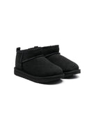 Stivali Ultra Mini per bambina UGG Kids neri con finitura idrorepellente 1130750K BLK UGG KIDS 