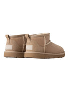 Stivali Ultra Mini per bambina Ugg Kids beige con design slip-on 1130750K SAN UGG KIDS 