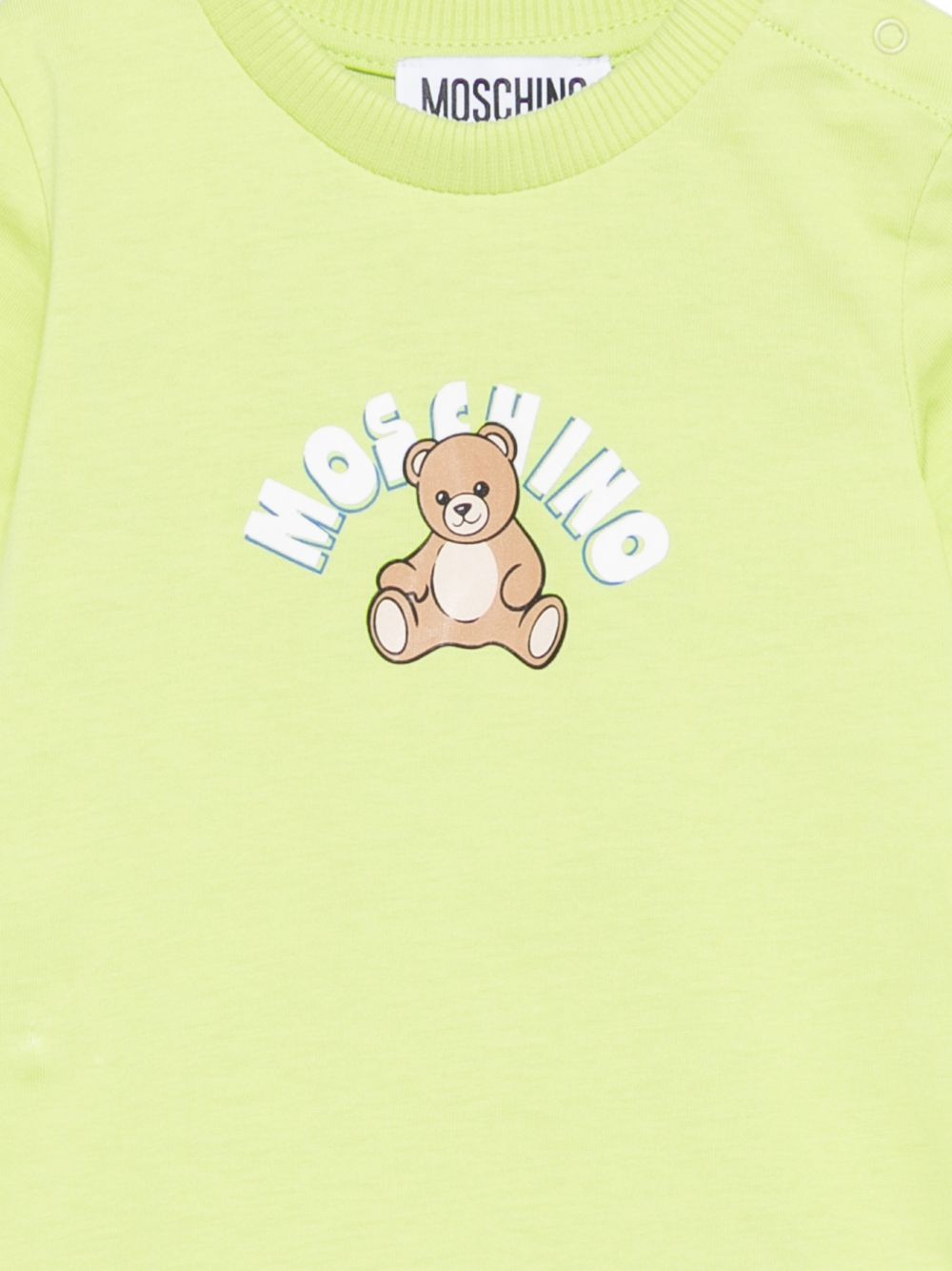 Tutina per neonati Moschino Kids verde con Teddy Bear sul davanti MTY022LAA01 30355 MOSCHINO KIDS 